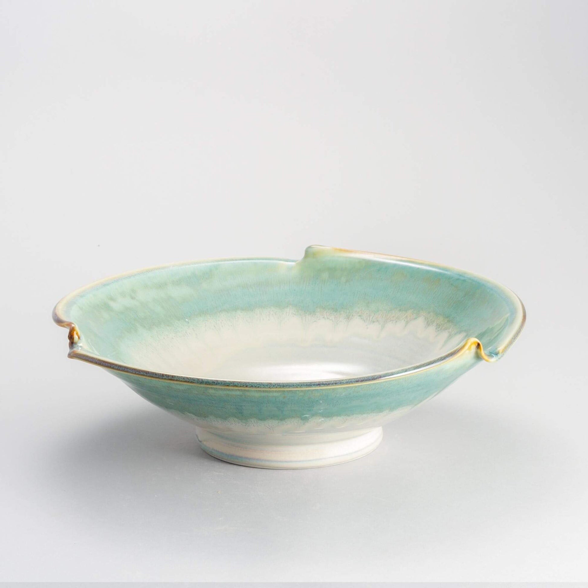 Handmade Pottery Signature Wave Bowl in Ivory & Green pattern made by Carroccia Tony  in Italy