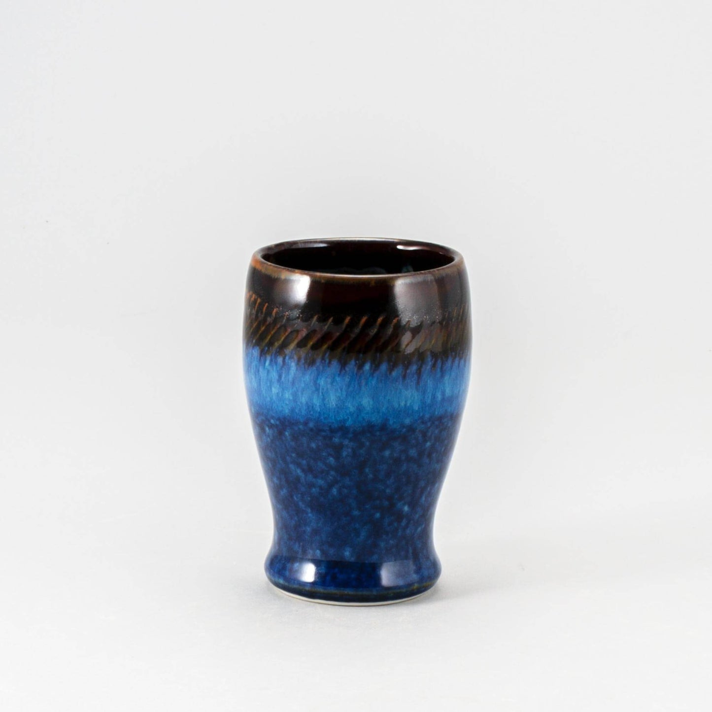 Handmade Pottery Curvy Tumbler in Blue Hamada pattern made by Carroccia Tony in Italy